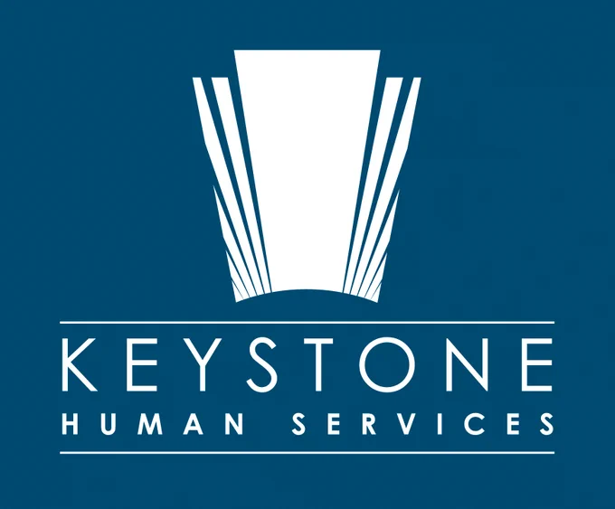 The logo for Keystone Human Services is a white keystone graphic over the words KEYSTONE HUMAN SERVICES in white on a blue background.