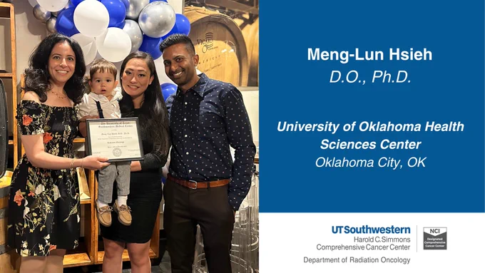 A woman in a black dress holding a baby, and accepting a graduation certificate from program leadership.