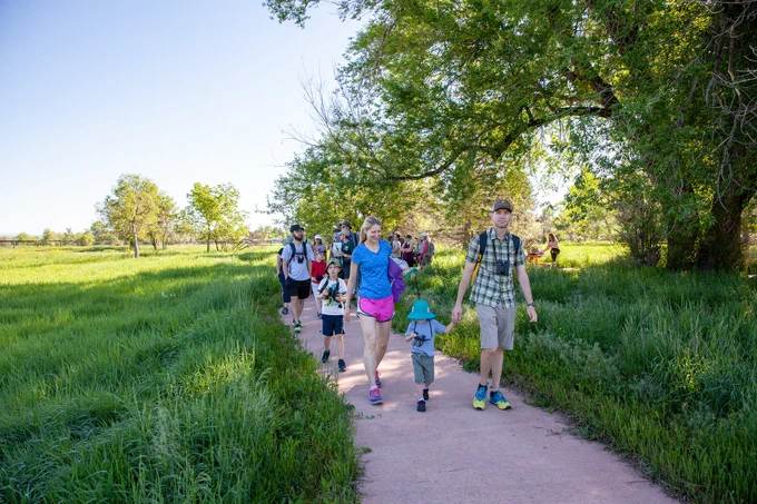 A group of people walking in a park