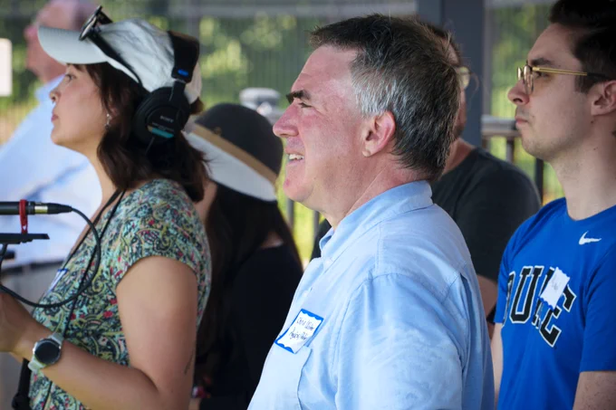 Professor Christopher Walter and other space enthusiasts braved the heat to watch the first images released by the Rubin Observatory on Duke’s scoreboard. (John West/Trinity Communications)
