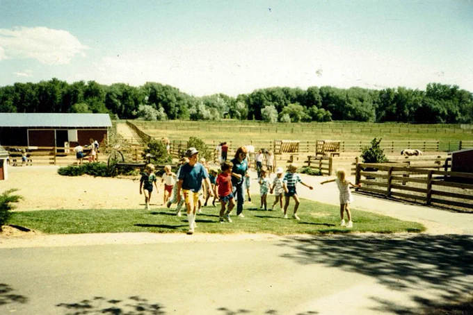 A historic image of kids walking through The Farm