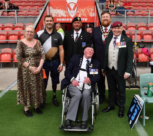 Mayor of St Helens Borough, Cllr Seve Gomez-Aspron, pictured at Saints game with members of Armed Forces Community, Veterans, Armed Forces Champion Cllr Lynn Clarke and Andy Reid MBE for Armed Forces Day event