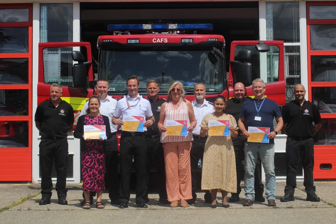 CRMP team standing in front of a fire engine