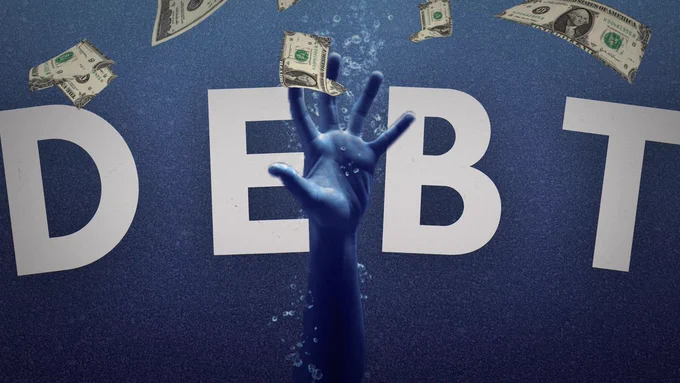 an underwater hand struggles and fails to reach for the surface - and for floating cash. the text reads "debt."