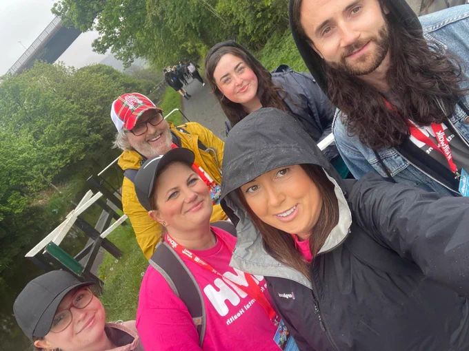The team take a selfie in the middle of a woodland walk