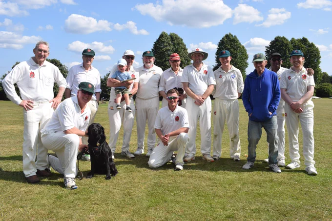 Bushmen team photo includes dog