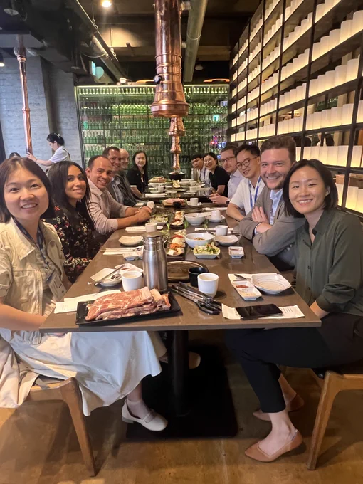Students and faculty celebrate at a restaurant