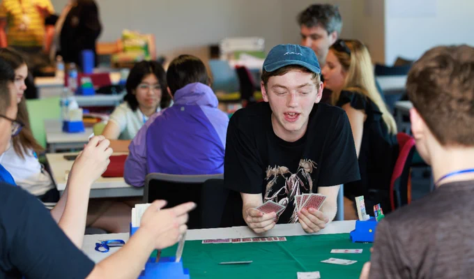 young people playing cards