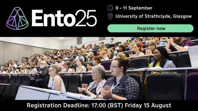 People seated in a conference hall applauding the speaker, advertising the Registration Deadline for Ento25