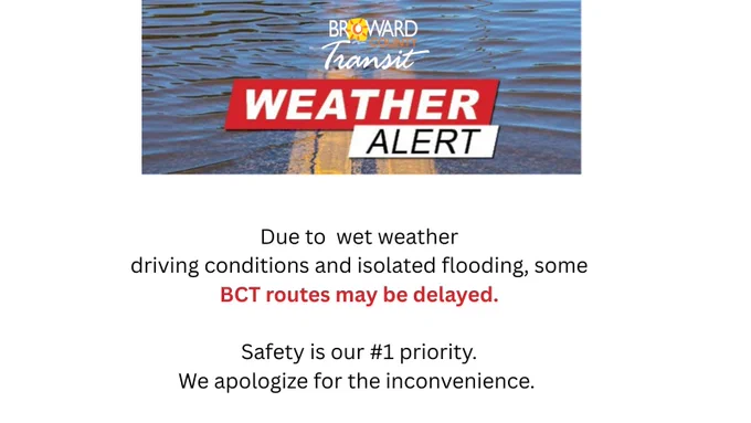 A weather alert graphic from Broward County Transit. On the left, a rainy cloud with sun and warning icon appears above text that reads: “Due to wet weather driving conditions and isolated flooding, some BCT routes may be delayed. Safety is our #1 priority. We apologize for the inconvenience.” On the right, a blurred photo shows traffic through a rain-covered window.