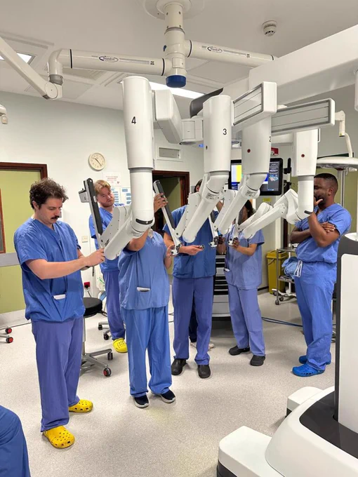 A photo of trainee surgeons at the event with the robotic technology.