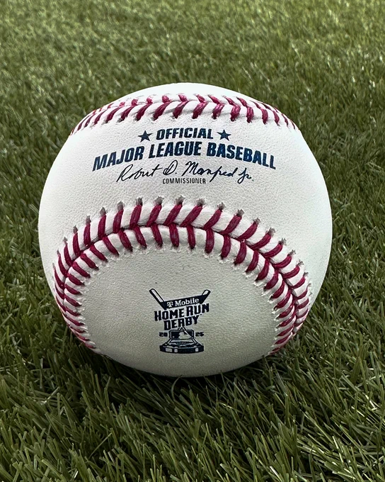 A white official Rawlings Major League Baseball with red stitching and the T-Mobile 2025 Home Run Derby logo on it in blue