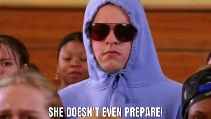 Photo of Damien from mean girls in a hoodie and sunglasses with the phrase “she doesn’t even prepare!”  written below him.