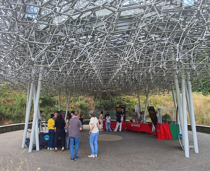 Visitors to the displays under the amazing structure of The Hive at Kew Gardens