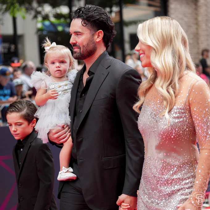 Robbie Ray walks through the red carpet with his family