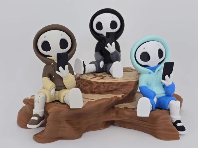 All three Project Hazy variants sitting together on a faux wood stump. Each figure is posed differently, showing color variation and articulation