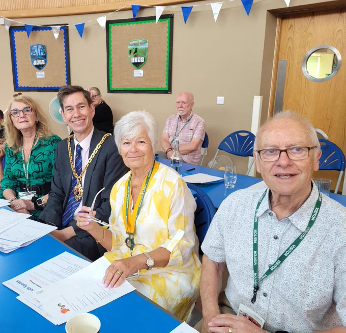 Mayor Matt Lamb sat at a table with three other people