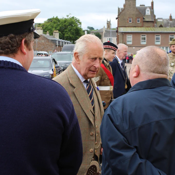 His Majesty King Charles III meeting and shaking hands with crew members from Campbeltown RNLI at Campbeltown harbour.