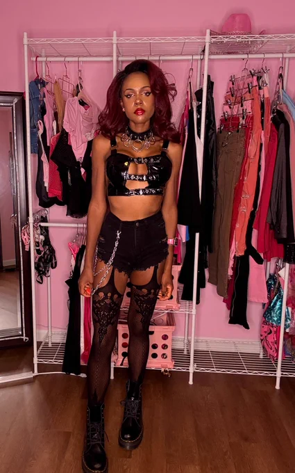 Anastasia Valentine fishnet garter alternative goth girl posing with ring light