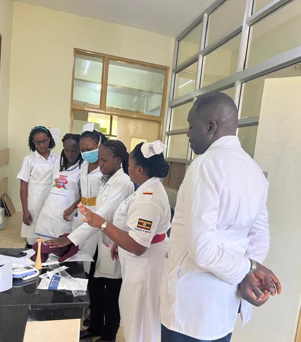 Dr Anita doing a return demonstration as Sr Moureen guides, while the Head of Gynecology and obstetrics Department, Dr David observes. 
