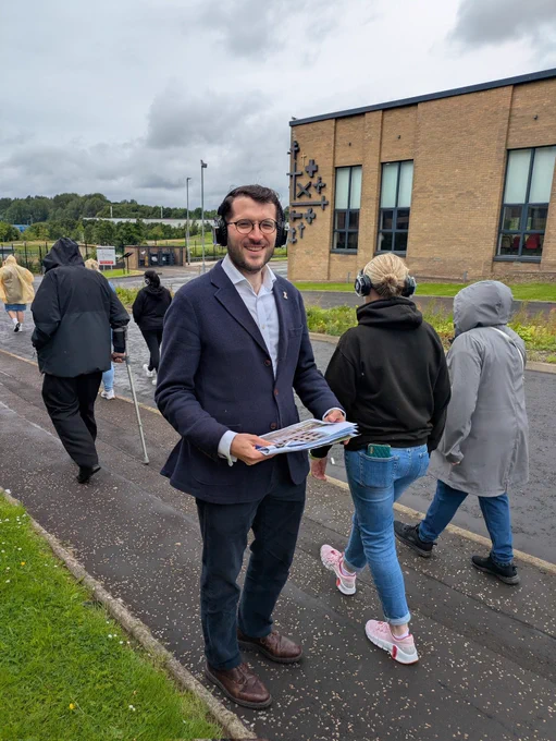 Paul Sweeney MSP listening to the Sighthill Audio tour