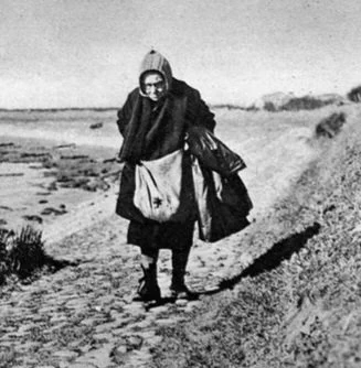 A postwoman on her long walk at Cockerham, Lancashire 