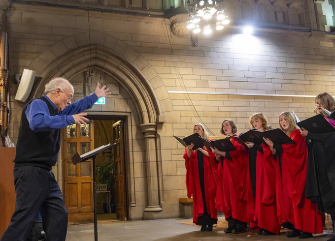 The National Schools Singing Programme patron, Sir John Rutter CBE conducts singers from the UofG Chapel Choir.