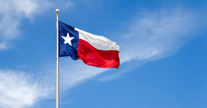 Texas flag flying.