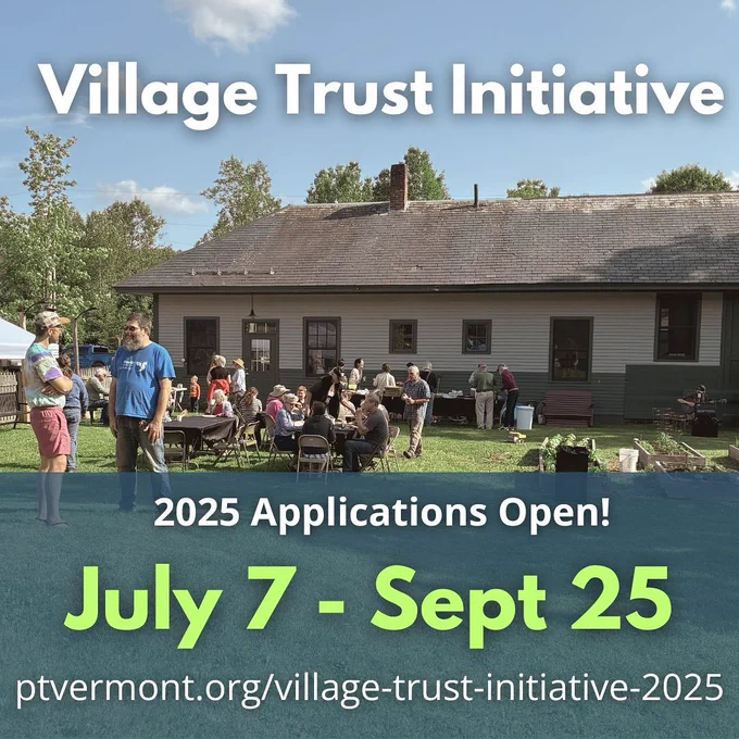 A photo of a gathering of people in front of an old railroad depot that is now a library in Wolcott with the words Village Trust Initiative 2025 Applications Open! July 7 - Sept 25. ptvermont.org/village-trust-initiative-2025