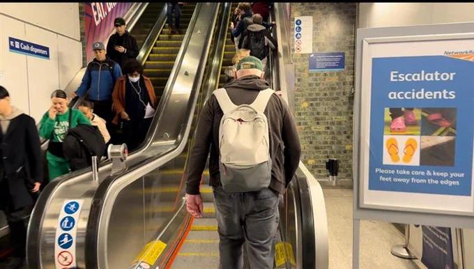 People can be seen travelling up and down the escalators at Waterloo underground station which leads to the main concourse at Waterloo train station