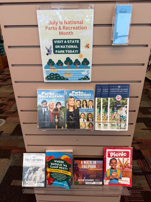 Endcap book display with books and DVDs about parks and recreation.