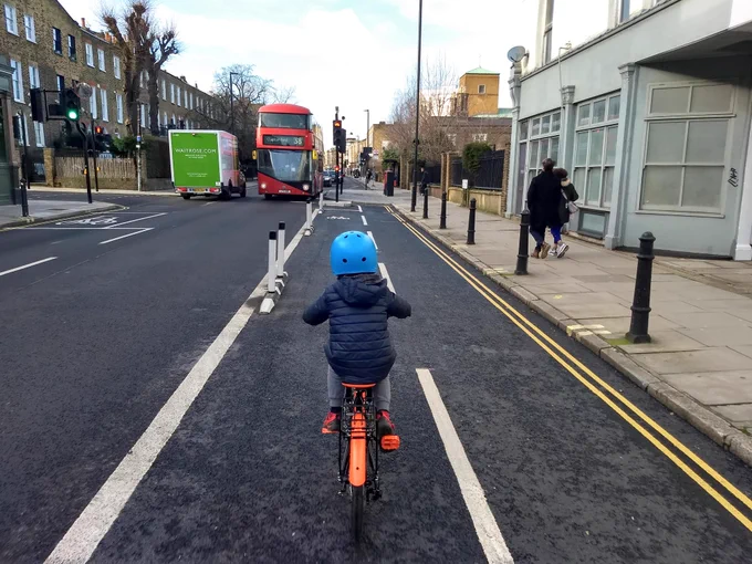 A child cycles on a cycle lane