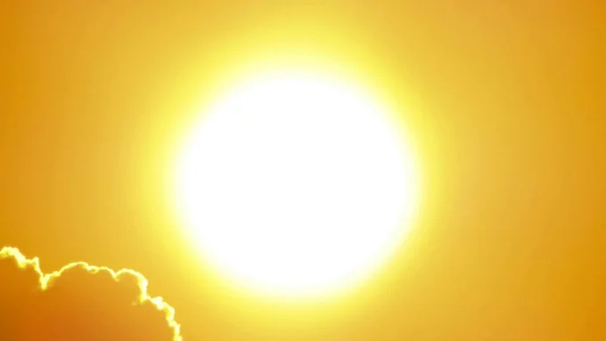 A sunny, sining, orange sun and sky