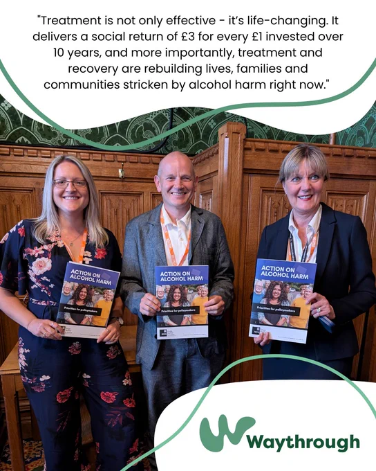 Three individuals holding pamphlets for Action on Addiction stand in a conference room in parliment, featuring a quote from the Action on Alcohol Harm report.