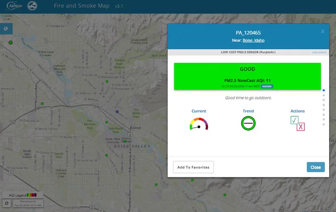 A screen shot of a topographical map overlaid with a blue and white text box that displays air quality conditions, with a green color bar showing good air quality conditions. 