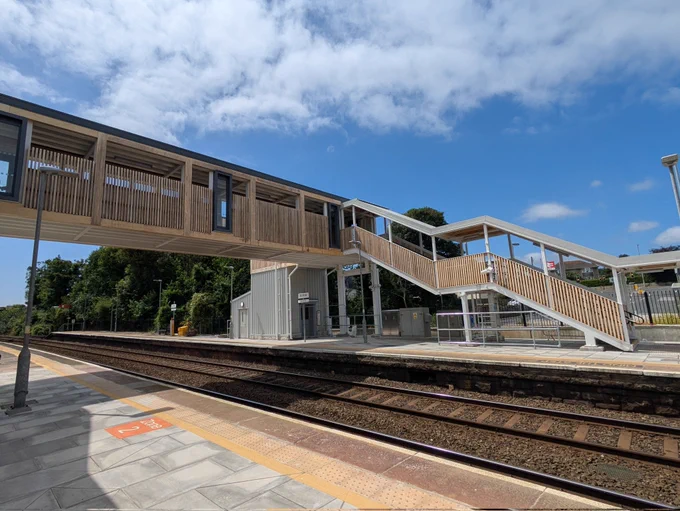 View of the new accessible footbridge at St Erth station, the sides are clad in timber. Photo taken from the station platform