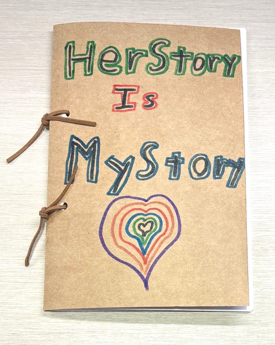 Hand-bound paper book. Cover says "HerStory Is MyStory" and has an illustration of a heart.