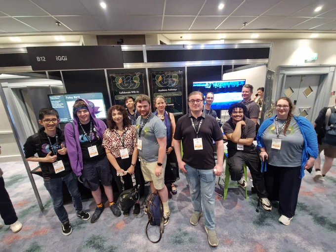 iggi researchers in front of their expo stand at the develop brighton conference