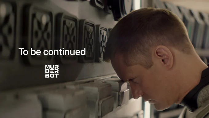 From Murderbot. Alexander Skarsgård as Murderbot rests its head against a wall. There is text on-screen that reads "To be continued" above the Murderbot logo.