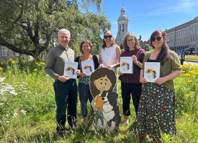 Prof Tom Curran, UCD; Prof Catherine Farrell, Trinity; Dr Máire Nic an Bhaird, Maynooth University; Prof Jane Stout, Trinity; and Dr Laoise Ní Chléirigh, Maynooth University, reading the comic in Trinity's Front Square.
