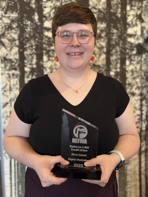 Bytes.co Senior Digital Marketing Specialist Hannah Hook smiling and holding the 2025 NEFFIE Award trophy