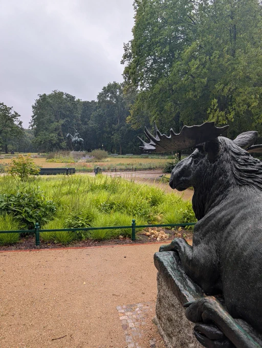Statue in Berlin park with stage statue in foreground