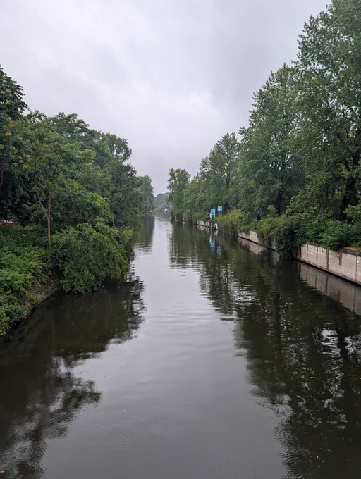 View of tree lined canal from bridge