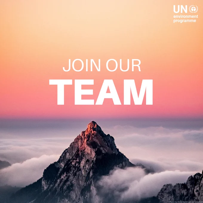 A mountain peak rises above a layer of clouds with a vibrant orange and pink sky in the background. The text 'JOIN OUR TEAM' is prominently displayed in white, bold letters at the center.