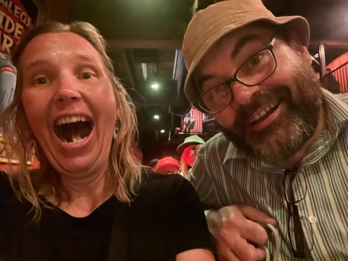 Two people laughing.