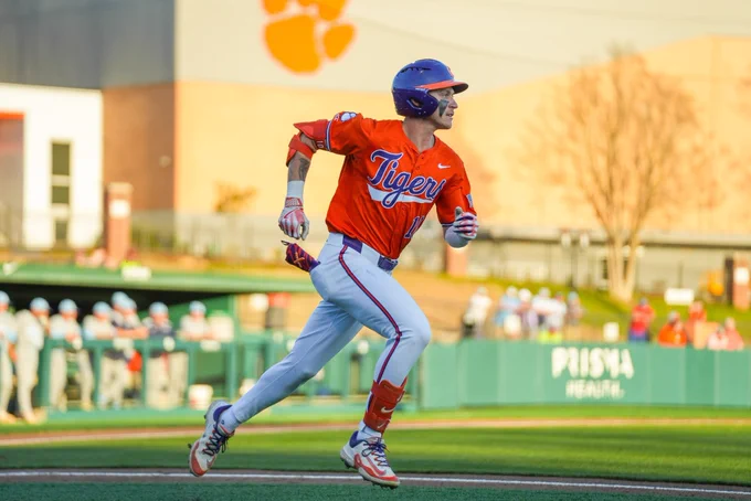 Cam Cannarella running on a baseball field.