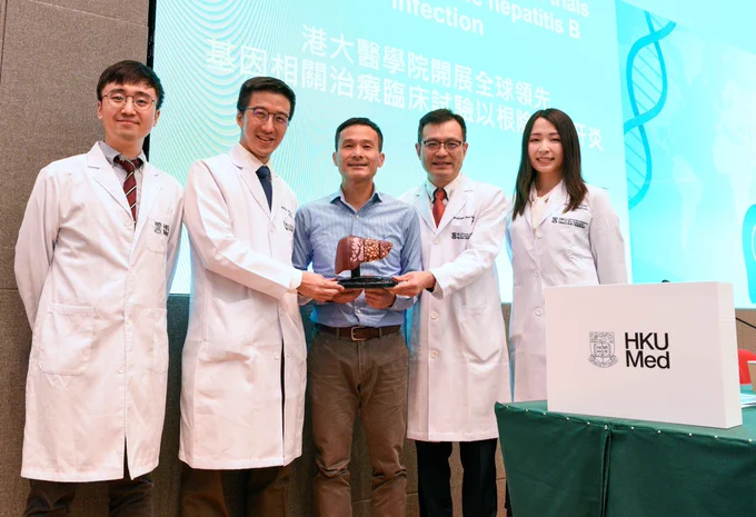 The research team, pictured in white coats from right, includes Professor Loey Mak, Professor Yuen Man-fung, Professor Walter Seto Wai-kay, and Dr Rex Hui, alongside Mr Cheung (middle), a patient who has completed his medication.