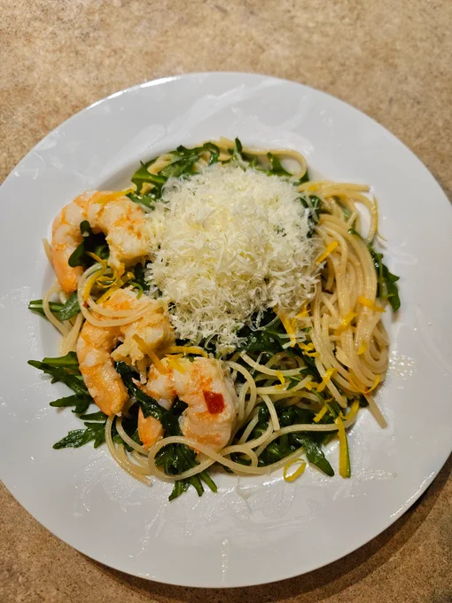 Dinner as described served on a round white soup plate.