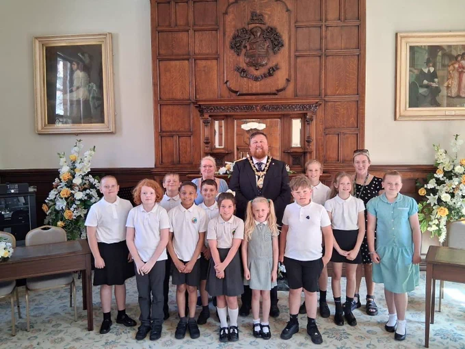 Mayor of St Helens Borough, Cllr Seve Gomez-Aspron, pictured with Rivington Primary School's school debate team and teacher in St Helens town hall