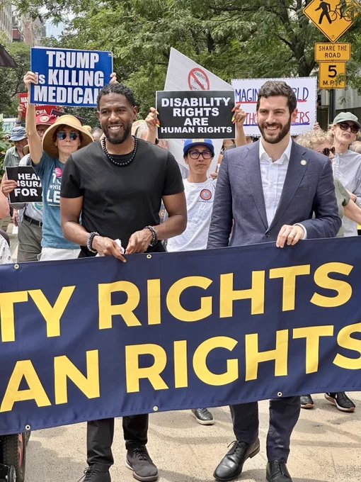 Assemblymember Alex Bores with the NYC Public Advocate at an ADA 35th anniversary protest, standing in solidarity with disability and labor advocates.